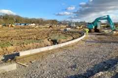Installing radius kerb for exit road